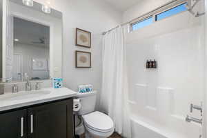 Full bathroom featuring shower / bathtub combination with curtain and vanity