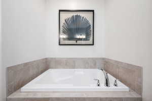 Full bath featuring a bath