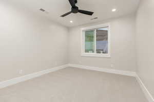 Unfurnished room featuring light carpet, recessed lighting, and a ceiling fan