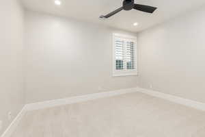 Carpeted spare room with recessed lighting and ceiling fan