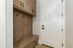 Mudroom with light wood finished floors
