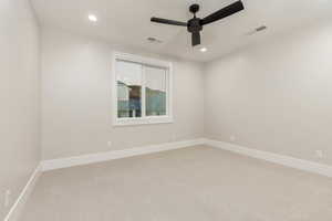 Unfurnished room with light carpet, a ceiling fan, and recessed lighting