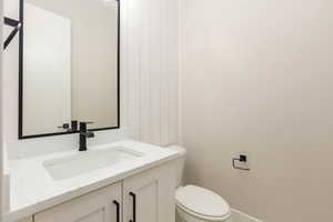 Bathroom featuring vanity and toilet