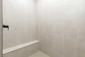 Bathroom featuring tiled shower