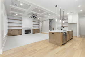 Kitchen featuring coffered ceiling, open floor plan, beam ceiling, open shelves, and recessed lighting