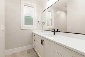 Bathroom featuring vanity and light tile patterned flooring
