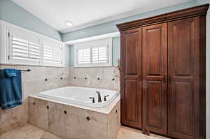 Full bath featuring a garden tub