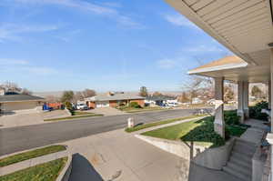 View of yard featuring a residential view and covered porch