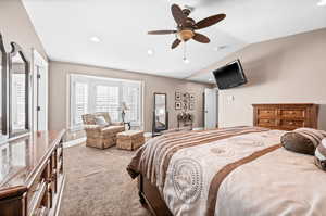 Bedroom featuring recessed lighting, carpet floors, ceiling fan, and lofted ceiling