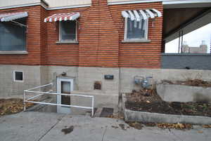 View of side of property with brick siding