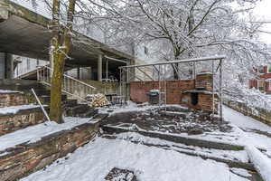 View of side of property with stairs