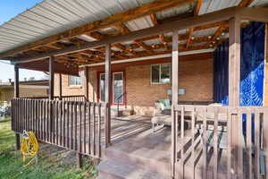 View of patio with a deck