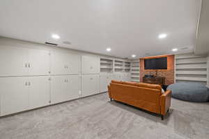 Living area with light colored carpet