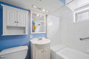 Full bathroom featuring vanity and shower / tub combination