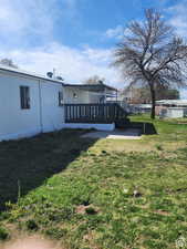 View of yard featuring a wooden deck