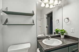Bathroom with vanity and toilet