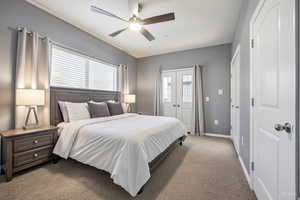 VIRTUALLY staged Bedroom featuring light carpet, multiple windows, ceiling fan, and a closet