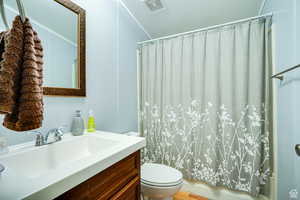 Bathroom featuring vanity and shower / tub combo