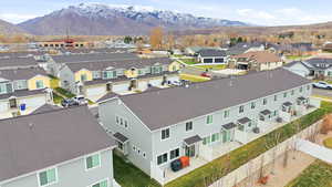 Aerial perspective of suburban area featuring a mountain backdrop