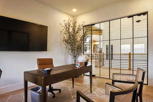 Home office with recessed lighting and baseboards