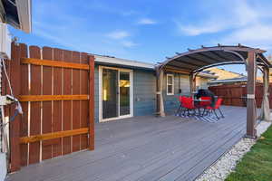 Wooden deck featuring outdoor dining space