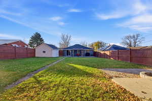 Back of house with a patio and a fenced backyard
