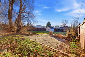 Fenced backyard with a patio area