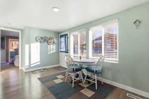 Dining area featuring wood finished floors