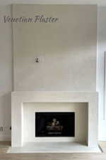 Detailed view of a fireplace and wood finished floors