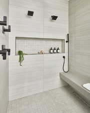 Bathroom featuring a tile shower
