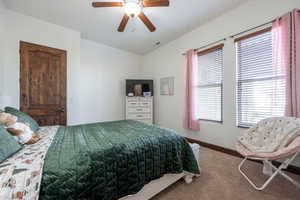 Bedroom featuring carpet flooring and a ceiling fan