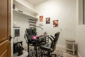 Office featuring baseboards and light wood finished floors