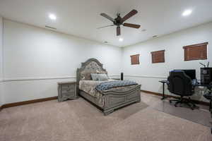 Bedroom featuring ceiling fan, carpet flooring, a desk, and recessed lighting