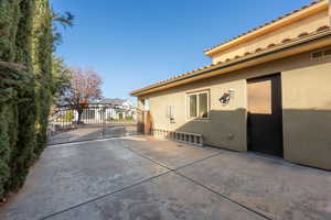 View of patio with a gate