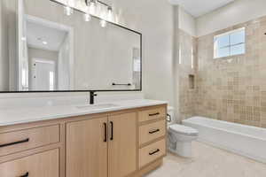 Full bath featuring vanity and  shower combination