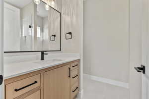 Bathroom featuring vanity and light tile patterned floors