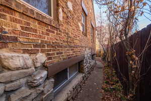 View of side of home with brick siding