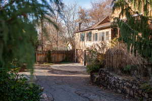 View of yard featuring driveway and an attached garage