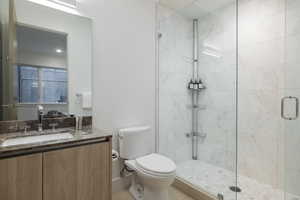Bathroom with vanity and a shower stall