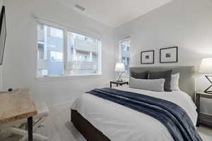 Bedroom with multiple windows