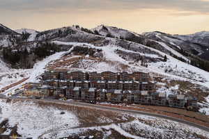 Snowy aerial view featuring a mountain view