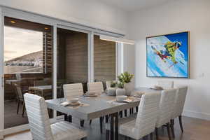 Dining area featuring baseboards and wood finished floors