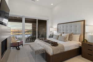 Bedroom featuring access to outside and recessed lighting