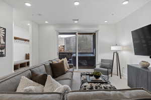 Living room with carpet and recessed lighting