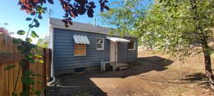 Rear view of house with roof with shingles