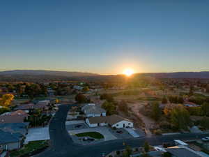 Aerial perspective of suburban area featuring a mountain backdrop