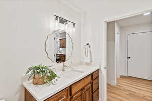 Bathroom featuring vanity and light wood-style flooring