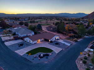 Aerial view of property's location featuring mountains