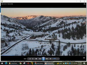 Snowy aerial view featuring a mountain view