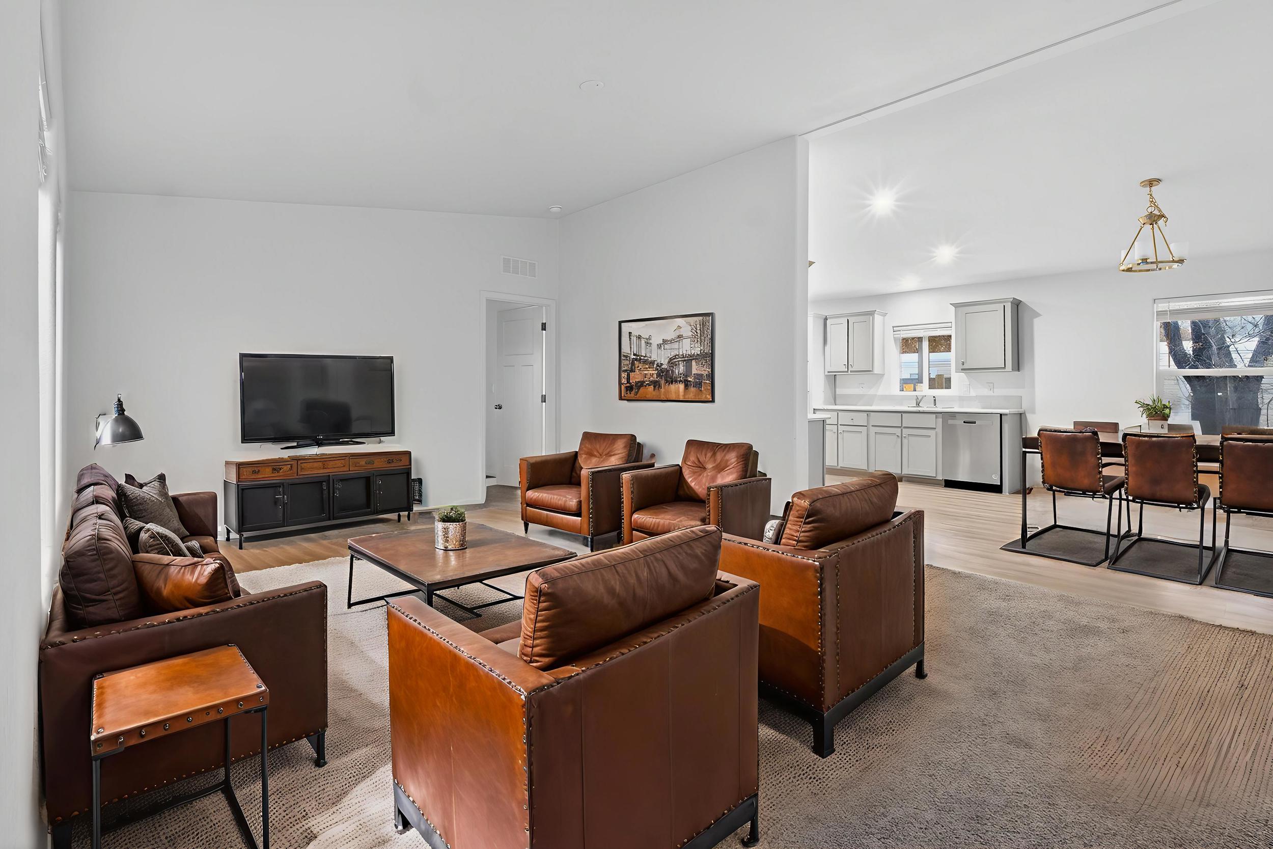 *Virtually Staged* Living room featuring lofted ceiling, light wood-style floors, and recessed lighting